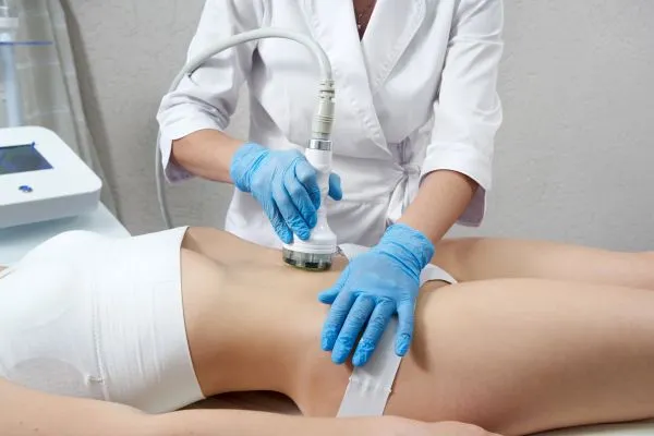 Lost the Weight but Not the Loose Skin? 2 woman having HIFU treatment on her stomach to combat loose skin Walton following weight loss